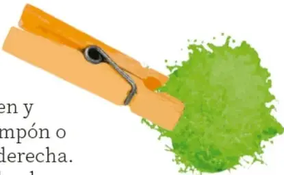 Pinza de ropa de madera con una bola de algodón o pompón verde en la punta.
