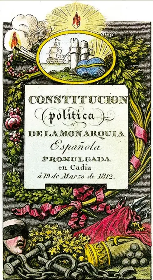 Portada ornamentada de la Constitución Política de la Monarquía Española, promulgada en Cádiz el 19 de marzo de 1812; incluye el escudo con un león y castillo, un yunque y cadenas rotas al pie. Fotomecánico, acervo INEHRM.