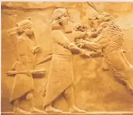 Relieve que representa a un guerrero asirio cazando leones.