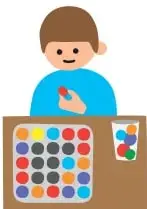 Niño colocando tapitas de colores sobre los espacios pintados de una bandeja de huevos.