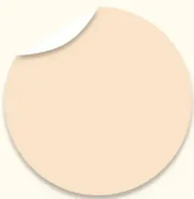 Círculo beige con esquina doblada, similar a una etiqueta o nota adhesiva.