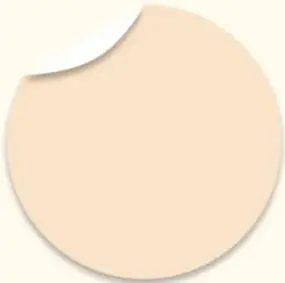 Círculo beige con esquina doblada, estilo pegatina, decorativo.