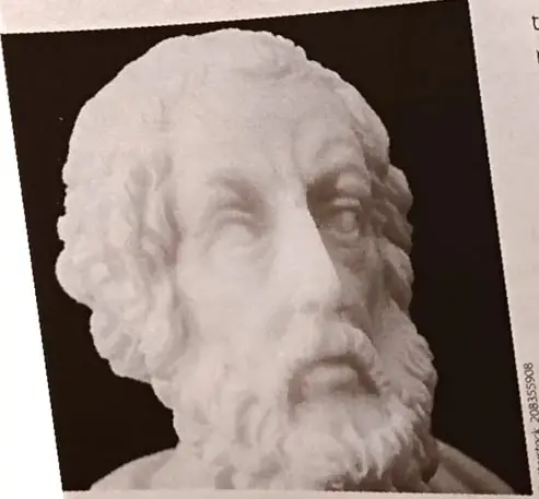 Busto de mármol que representa tradicionalmente a Homero, acompañado de una nota sobre la falta de comprobación histórica de su existencia.