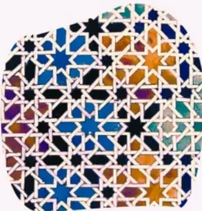 Fotografía de un mosaico geométrico islámico con estrellas y polígonos de varios colores (azul, naranja, negro, blanco).