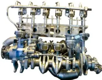 Motor de combustión interna desarmado, mostrando pistones y componentes metálicos.