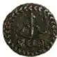 Fotografía del reverso de una moneda de plata (Moneda Insurgente SUD, Morelos, 1/2 Real, 1813, diámetro 15 mm), Colección Casa de Moneda de México, Museo Numismático Nacional.