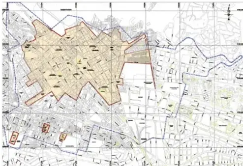 Mapa topográfico de una ciudad con calles y zonas verdes.