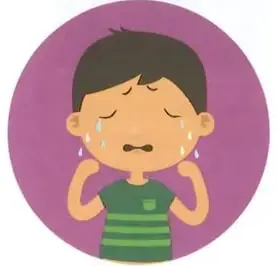 Niño llorando con la palabra «triste».