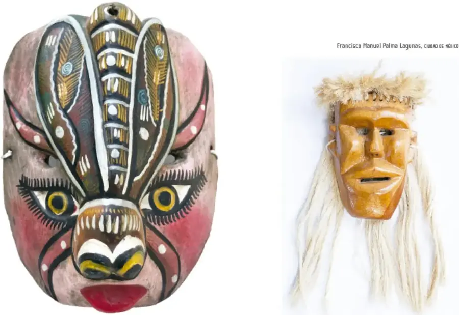 Máscara tallada y pintada: rostro rosado, ojos amarillos grandes, cejas negras, nariz ancha con lengua o motivo pintado y alas o plumas decorativas sobre la frente.
