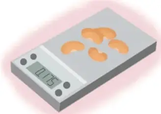 Balanza de precisión con nueces, mostrando 0.75 g (miligramos).