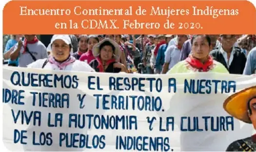 Mujeres indígenas en el Encuentro Continental de Mujeres Indígenas en la CDMX, febrero de 2020, con pancarta que exige respeto a la madre tierra y territorio.