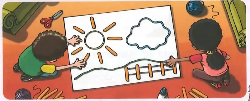 Niños elaborando un paisaje sobre una cartulina con lana y palos de helado.