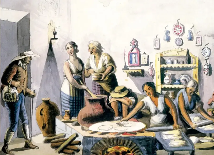 Ilustración titulada 'Interior de cocina mexicana' (1810-1827) que muestra a varias mujeres trabajando en una cocina con fogón, ollas de barro, utensilios y un hombre observando desde la izquierda; representa la vida cotidiana de mujeres pobladoras de México en ese periodo.