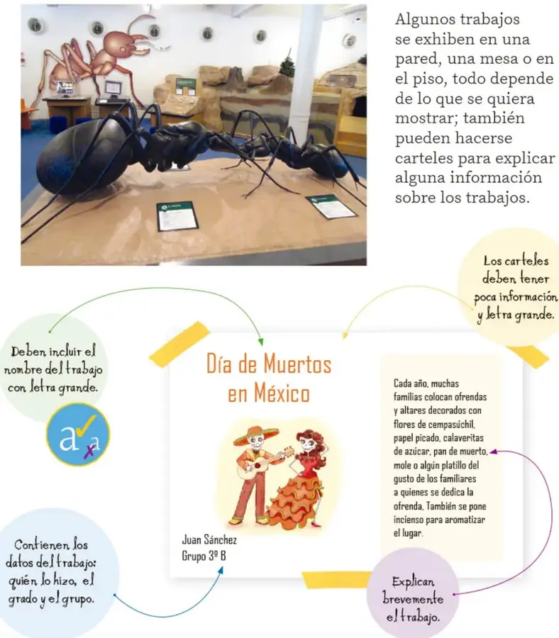 Fotografía de una exhibición de maquetas de hormigas gigantes con cartelas informativas sobre una mesa.