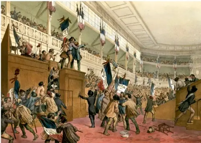 Pintura histórica que representa la sesión de la Asamblea Nacional en un recinto con gradas llenas de diputados y público; algunos personajes levantan banderas y documentos, en un ambiente de debate revolucionario.