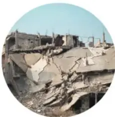 Fotografía circular de edificios derrumbados, rotulada 'Sismo'