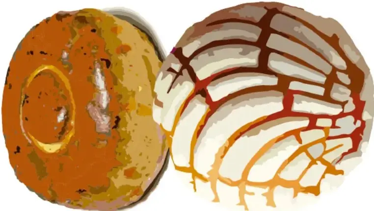 Dos panes tradicionales mexicanos: uno redondo con ajonjolí y otro con costra de azúcar.