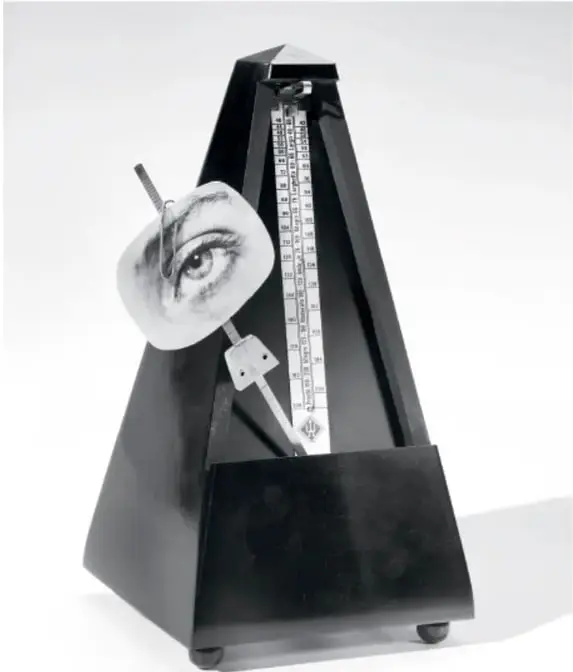 Metrónomo negro con un ojo recortado colocado sobre la aguja, objeto surrealista característico de Man Ray.