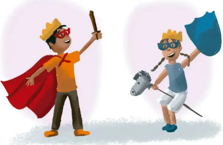 Dos niños disfrazados de personajes: uno con capa roja, corona y espada; otra con corona, escudo y lanza con cabeza de caballo.