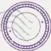 Sello circular con líneas onduladas, similar a una estampilla postal.