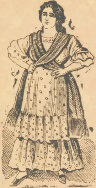 Ilustración de una mujer de cuerpo entero con vestido de varios vuelos, rebozo cruzado al pecho y manos en la cintura, que representa a la Cucaracha.