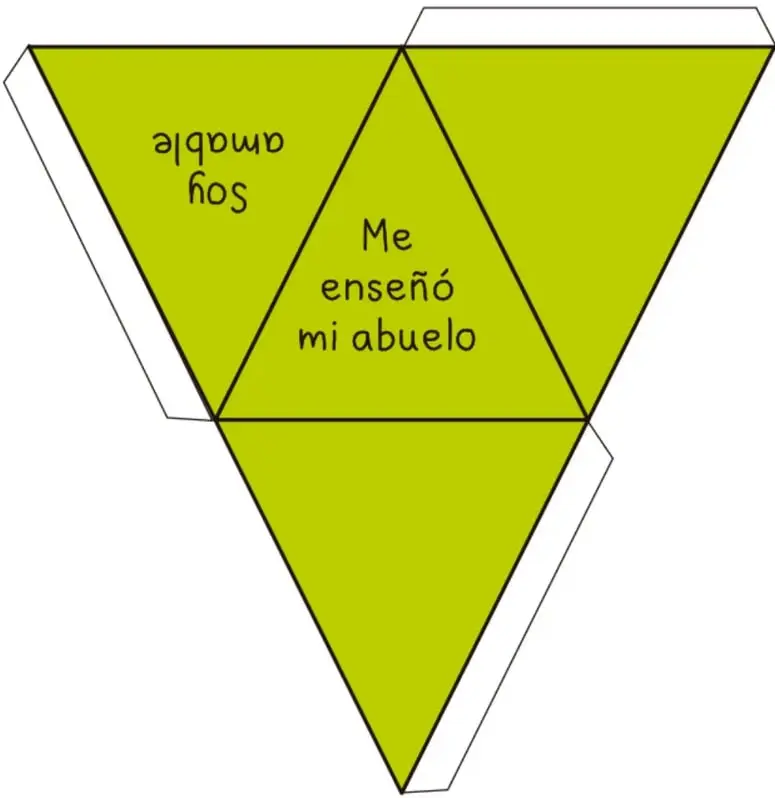Cuerpo geométrico verde con forma de estrella de tres puntas (triángulo de Reuleaux) armado con cartón; en el centro dice 'Me enseñó mi abuelo' y en una pestaña lateral, en espejo, 'amor de abuelo'.