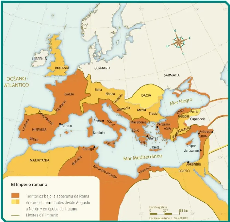 Mapa del Imperio romano en su máxima expansión, con provincias en naranja (soberanía de Roma) y amarillo (anexiones desde Augusto a Nerón y Trajano). Se señalan límites con línea verde, escala 1:32 700 000 y rosa de los vientos.
