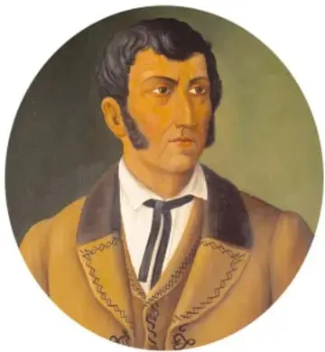 Retrato ovalado de un hombre joven con patillas, cabello oscuro y traje color mostaza con corbata negra.