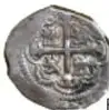 Fotografía del reverso de una moneda macuquina de plata con ficha de identificación (Carlos II, 1/2 Real, México).