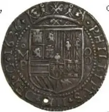 Dos monedas antiguas de plata, una de ellas con la inscripción 'PLUS ULTRA' y el escudo de España.