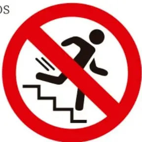 Señal de prohibición circular de color rojo con la silueta negra de una persona tropezando al bajar una escalera, indicando prohibido causar riesgo de caída en las escaleras.
