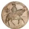 Fotografía del reverso de una medalla de plata de Carlos I Rey de España y de las Indias, 20 onzas, acuñada en México en 2000, con un jinete a caballo; colección de la Casa de Moneda de México, Museo Numismático Nacional.