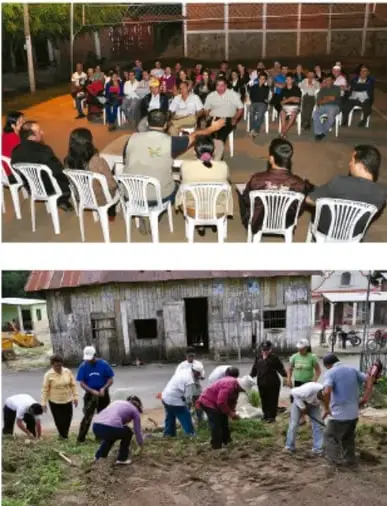 Grupo de personas sentadas en círculo en un espacio comunitario, reunidas en asamblea.