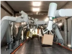 Brazos robóticos manipulando cajas en una cinta transportadora, representando aplicaciones de robótica.