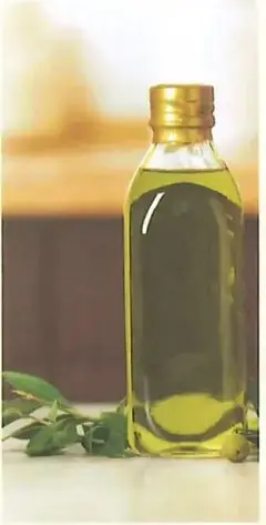 Botella transparente con líquido y tapa metálica.