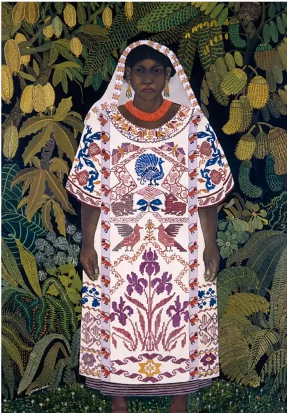 Reproducción de la pintura 'India oaxaqueña' (1928) de Ramón Cano Manilla: una mujer indígena de pie, con vestimenta tradicional bordada en blanco, rojo y azul, tocado blanco y collar naranja, sobre un fondo selvático con plantas y frutos.