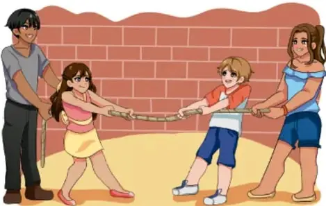 Niños y niñas jugando tiro de cuerda frente a un muro de ladrillos.