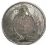 Fotografía del reverso de una medalla colonial de plata de Carlos IV con efigie y leyenda, junto a su ficha catalográfica.