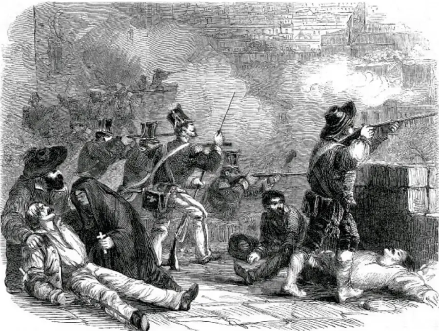 Grabado en blanco y negro que muestra una escena de combate callejero con soldados armados, humo, personas heridas y una figura femenina auxiliando a un caído; al fondo se observan edificios.
