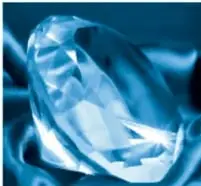 Diamante azul facetado sobre fondo oscuro.