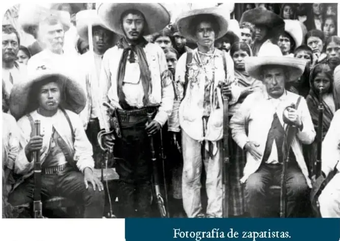 Fotografía en blanco y negro de un grupo de zapatistas, hombres con sombrero y armas, durante la Revolución Mexicana.