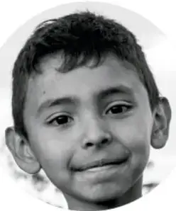 Fotografía de un niño sonriendo.