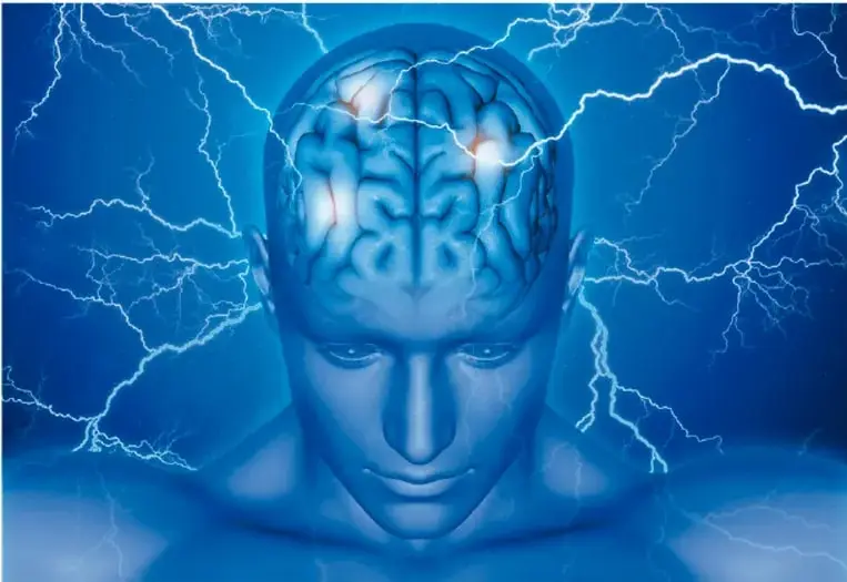 Ilustración de un rostro humano en tonos azules con el cerebro visible y rayos eléctricos que salen de él, representando la actividad eléctrica del sistema nervioso.