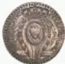Fotografía del anverso de una moneda de plata: Proclama de Fernando VII, Ciudad de Toluca, México, 1809, diámetro 34 mm, Casa de Moneda de México.