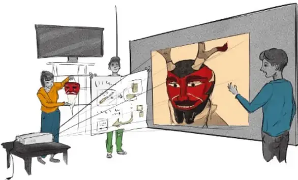 Ilustración de tres estudiantes preparando una muestra: uno sostiene un cartel con imágenes, otro observa una pantalla con un rostro rojo estilizado (máscaras/arte), junto a un pizarrón y una mesa, en un aula.