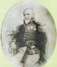Retrato de José de Villamil, presentado como prócer de la Independencia de Guayaquil. El texto indica que reunió a los interesados en organizar la revolución y que su esposa, Ana Garaycoa, apoyó el movimiento mediante tertulias.