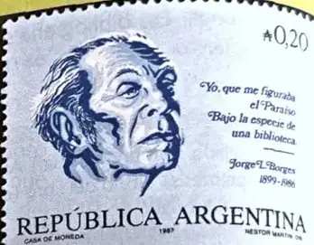 Imagen de una estampilla de la República Argentina con el retrato de Jorge Luis Borges y una referencia a una biblioteca.
