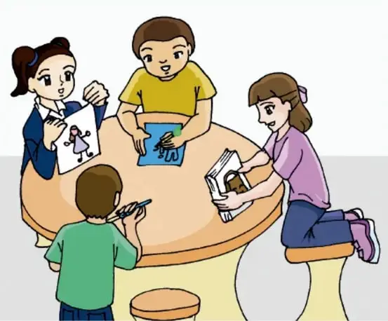 Equipo de cuatro niños trabajando con dibujos y un libro sobre la mesa; créditos a Irene Reyes Santiago, Estado de México.