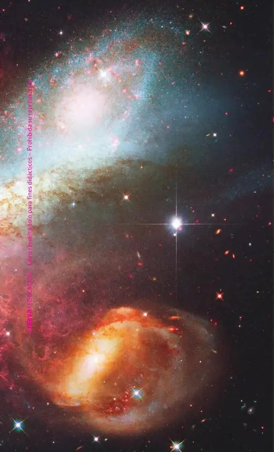 Imagen de una región del universo con estrellas, gases luminosos y estructuras semejantes a galaxias.