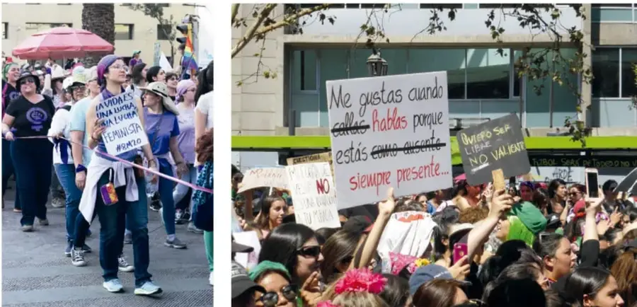 Fotografía de una marcha: mujeres con banderas y carteles, una con el lema 'La vida es una lucha feminista #8M20', sombrillas y bandera arcoíris.